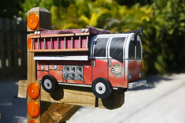 A mailbox in the shape of a fire truck is seen along the highway US-1 in the Lower Keys near Marathon in Florida, July 11, 2014. (Photo by Wolfgang Rattay/Reuters)