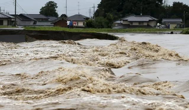 A view of flood waters from the Kinugawa river (R) caused by typhoon Etau at a residential area in Joso, Ibaraki prefecture, Japan, September 10, 2015. (Photo by Issei Kato/Reuters)