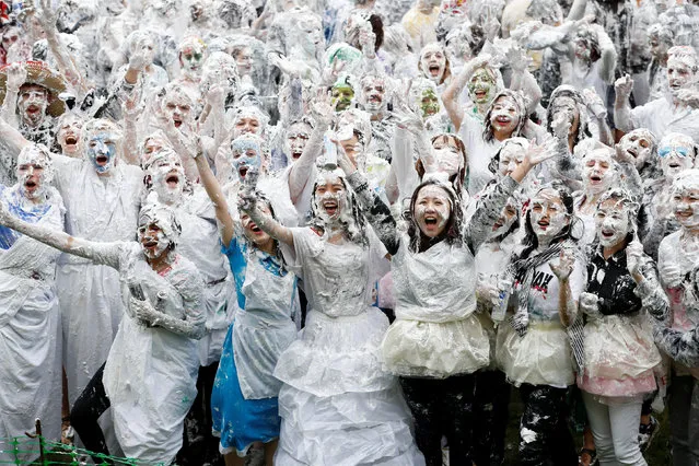 Students from St Andrews University are covered in foam as they take part in the traditional “Raisin Weekend” in the Lower College Lawn, at St Andrews in Scotland, Britain on October 23, 2017. (Photo by Russell Cheyne/Reuters)