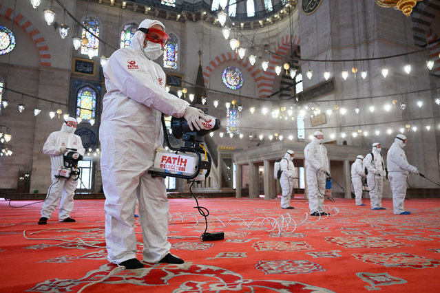 Fatih Municipality teams clean the Suleymaniye Mosque as part of the disinfection work carried out before Ramadan in historical mosques in Istanbul, Turkiye on February 25, 2025. (Photo by Mehmet Murat Onel/Anadolu via Getty Images)