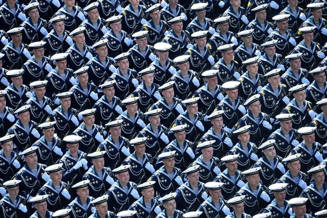Russian sailors march during the Victory Day Parade in Red Square in Moscow, Russia, June 24, 2020. The military parade, marking the 75th anniversary of the victory over Nazi Germany in World War Two, was scheduled for May 9 but postponed due to the coronavirus outbreak. (Photo by Mikhail Voskresenskiy/Host Photo Agency via Reuters)