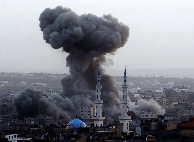 Smoke rises after an Israeli strike in Gaza City on Saturday. (Photo by Hatem Moussa/Associated Press)