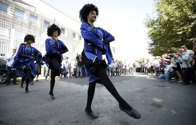 Performers dance during a rally to demand better relations with Russia in Tbilisi, Georgia, September 24, 2015. (Photo by David Mdzinarishvili/Reuters)