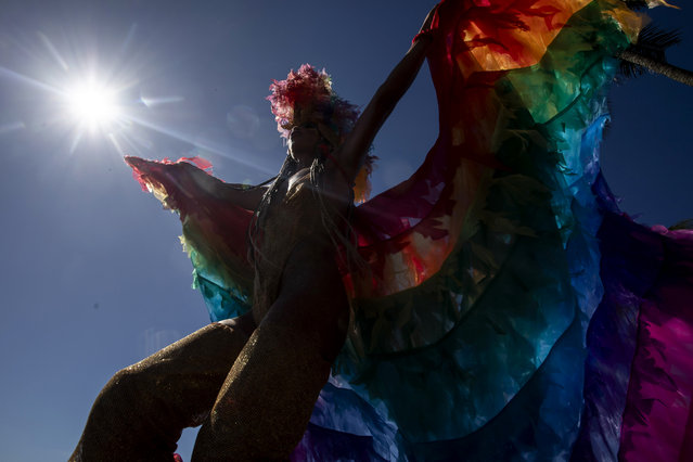 Raquel Poti performs on stilts during the Amigos da Onca street Carnival party, in Rio de Janeiro, Brazil, Saturday, February 10, 2024. (Photo by Bruna Prado/AP Photo)
