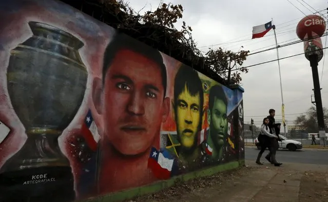 (L-R) Paintings depicting Chile's Alexis Sanchez, Brazil«s Neymar and Mexico's Rafael Marquez are seen next to at Nacional Stadium in Santiago, Chile July 1, 2015. (Photo by Henry Romero/Reuters)