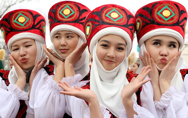 Kyrgyz girls pose in traditional costumes during the Nowruz celebration in Bishkek, Kyrgyzstan, 20 March 2024. Nowruz is the Persian New Year celebrated by various ethnic groups worldwide and it traditionally marks the first day of spring. (Photo by Igor Kovalenko/EPA/EFE)
