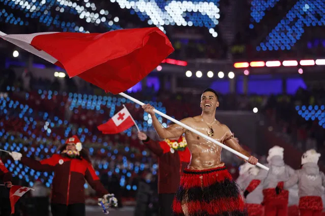 Pita Taufatofua carries the flag of Tonga during the opening ceremony of the 2018 Winter Olympics in Pyeongchang, South Korea, Friday, February 9, 2018. (Photo by Jae C. Hong/AP Photo)