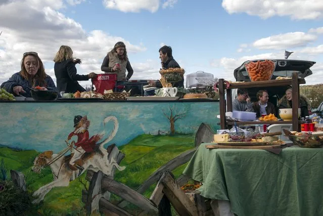 Revellers attend a tailgate party at the Far Hills Race Day at Moorland Farms in Far Hills, New Jersey, October 17, 2015. (Photo by Stephanie Keith/Reuters)