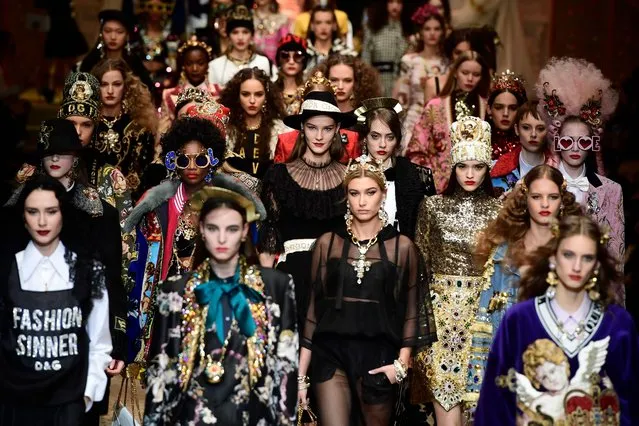 Models present creations by Dolce & Gabbana during the women's Fall/Winter 2018/2019 collection fashion show in Milan, on February 25, 2018. (Photo by Miguel Medina/AFP Photo)