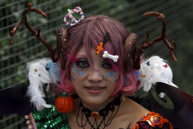 A participant in costume poses for a picture after a Halloween parade in Kawasaki, south of Tokyo, October 25, 2015. (Photo by Yuya Shino/Reuters)