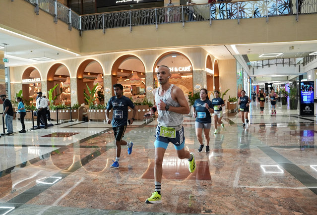 Participants run during the Dubai Mallathon in City Centre Mirdif Mall, in Dubai, United Arab Emirates, on August 9, 2025. (Photo by Raghed Waked/Reuters)