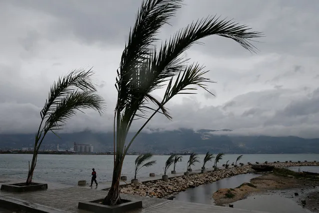 A man walks on a pier while Hurricane Matthew approaches in Port-au-Prince, Haiti October 3, 2016. (Photo by Carlos Garcia Rawlins/Reuters)