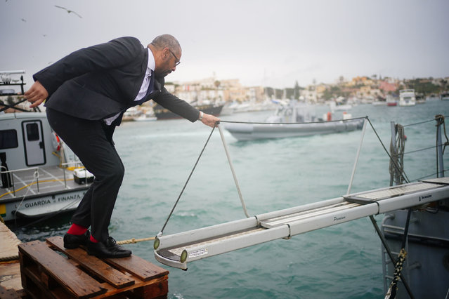 The British Home Secretary James Cleverly on Wednesday, April 24, 2024 climbs onto a Guardia di Finanza police boat in Lampedusa Port to learn about how they tackle the issue of migrants crossing from Africa to the Italian island. (Photo by Victoria Jones/PA Images via Getty Images)
