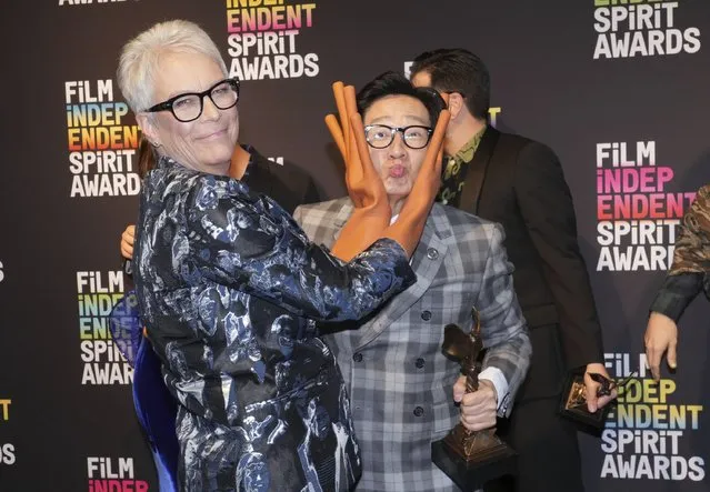 American actress Jamie Lee Curtis, left, wearing hot dog fingers based on a prop from the film “Everything Everywhere All at Once”, poses in the press room with Vietnamese-American actor Ke Huy Quan at the Film Independent Spirit Awards on Saturday, March 4, 2023, in Santa Monica, Calif. The cast and crew won the award for best feature for “Everything Everywhere All at Once”. (Photo by Jordan Strauss/Invision/AP Photo)