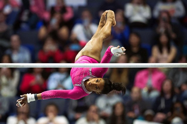 American gymnast Simone Biles competes on the uneven bars during the Core Hydration Classic in Hartford, Connecticut, on Saturday, May 18, 2024. Biles won the all-around gold, marking a perfect start to her season before the Olympic Games in Paris this summer. (Photo by Charly Triballeau/AFP Photo)