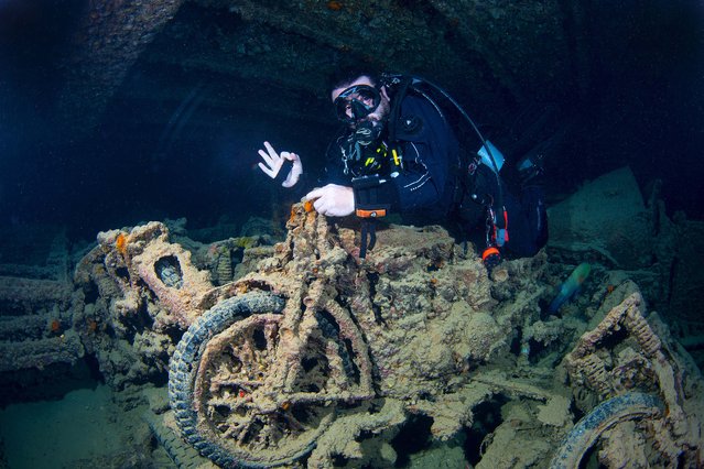 A view of the underwater remains of the British cargo ship “Thistlegorm”, which was sunk by German aircraft in 1941 after being deployed to transport military supplies from England to Egypt during World War II, in Egypt on September 10, 2025. The wreck, situated about 40 kilometers west of Sharm El-Sheikh, stands as one of the Red Sea's most popular diving spots. Armored vehicles, torpedoes, jeeps, rifles and Norton motorcycles designed for desert use, along with wagons lying in the dark waters, reveal traces of history while serving as a habitat for diverse marine life. (Photo by Tahsin Ceylan/Anadolu via Getty Images)