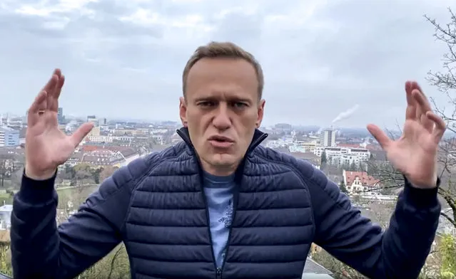In this handout photo taken from a video released on Wednesday, January 13, 2021, by Russian opposition activist Alexei Navalny in his instagram account, Russian opposition activist Alexei Navalny gestures as he records his address. Top Kremlin critic Alexei Navalny says he will fly home to Russia over the weekend despite the Russian prison service's latest motion to put him behind bars for allegedly breaching the terms of his suspended sentence and probation. (Photo by Navalny Instagram account via AP Photo)