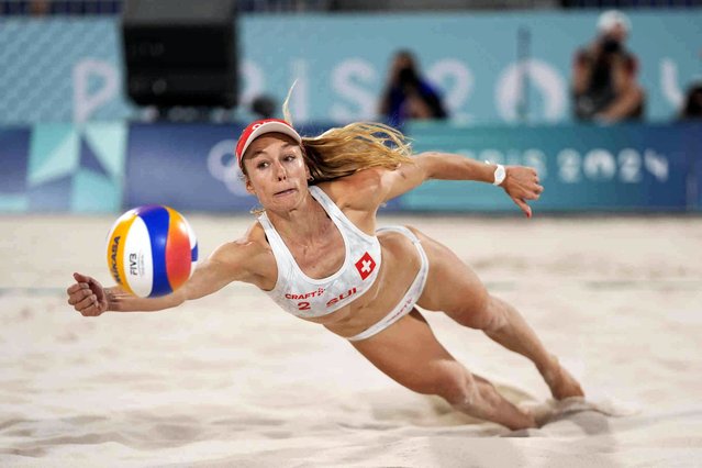 Switzerland's Nina Brunner dives for a return in the women's beach volleyball bronze medal match between Australia and Switzerland, at the 2024 Summer Olympics, Friday, August 9, 2024, in Paris, France. (Phoot by Robert F. Bukaty/AP Photo)