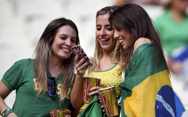 Fans of Brazil wait for the start of the Confederations Cup Group A soccer match between Brazil and Mexico at the Estadio Castelao in Fortaleza June 19, 2013. (Photo by Jorge Silva/Reuters)