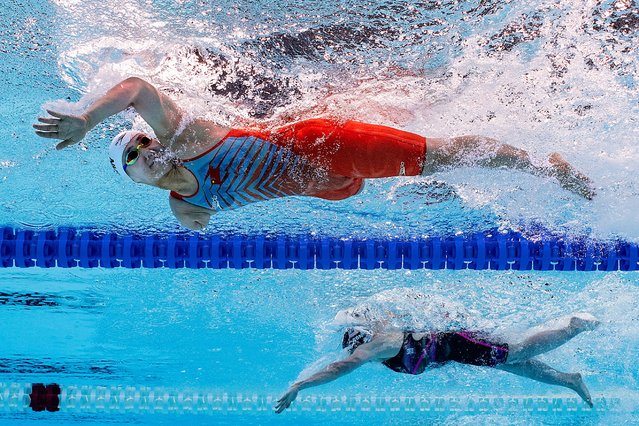 This handout photograph taken and released by OIS/IOC on September 4, 2024 shows China's Yuyan Jiang competing alongside US McKenzie Coan in the Para Swimming Women’s 100m Freestyle - S7 Final during the Paris 2024 Paralympic Games at the Paris La Defense Arena in Nanterre, west of Paris. (Photo by Joel Marklund/OIS/IOC via AFP Photo)