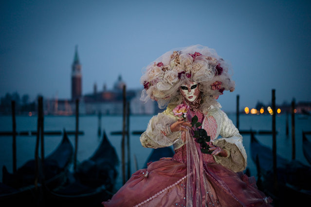 “Carnevale di Venezia”. Each year, the Carneval in Venice is celebrated prior to lent. History depicts a celebration whereby revellers would enjoy several weeks of partying to rid their pantry of meat prior to 40 days of fasting. Today the traditions continue with street parties, balls and events whereby revellers dress in a costume and mask. The City of Venice puts on a grand show of events and activities, including masked and costumed folk who willingly pose for the camera in the most scenic of backgrounds.  (Photo and caption by Lidia D'Opera/National Geographic Traveler Photo Contest)