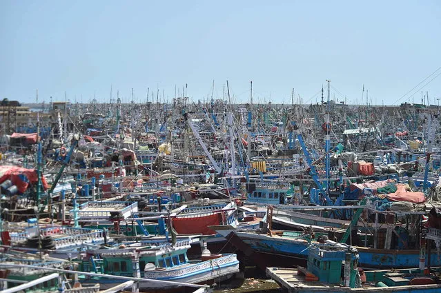 Fishing boats are anchored after a warning issued by the authorities to avoid deep sea due to cyclone Biparjoy, in Karachi, Pakistan, 11 June 2023. Cyclone Biparjoy, which is currently over the Arabian Sea, intensified on 11 June to an 'extremely severe' storm ahead of its expected arrival in India and Pakistan in the coming days. Pakistan Meteorological Department (PMD) said that the country's southern coast would begin to feel the effects of the cyclone on 13 June afternoon or evening, noting that high intensity winds may cause damage to loose and vulnerable structures. (Photo by Shahzaib Akber/EPA/EFE)