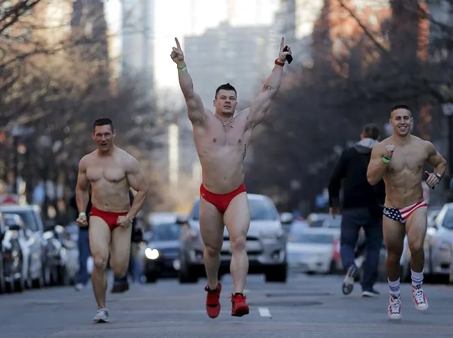 Participants run through the streets of the Back Bay during the 16th annual Santa Speedo Run in Boston, Massachusetts, December 12, 2015. (Photo by Brian Snyder/Reuters)