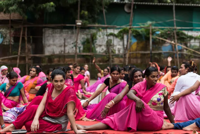 Members of a transgender community perform yoga at a school in Vikhroli on the occasion of World Yoga day, on June 21, 2018 in Mumbai, India. The first International Yoga Day was observed all over the world on June 21, 2015. The idea of International Yoga Day was first proposed by the PM during his speech at the United Nations General Assembly on September 27, 2014. He also suggested June 21 be observed as International Yoga Day all over the world, as it is the longest day of the year in the Northern Hemisphere and has special significance in many parts of the world. (Photo by Aalok Soni/Hindustan Times via Getty Images)