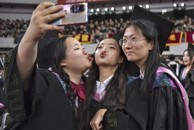 The 2023 undergraduate graduation ceremony and degree awarding ceremony of Shandong University are held Jinan City, east China's Shandong Province on June 18, 2023. (Photo by Rex Features/Shutterstock)