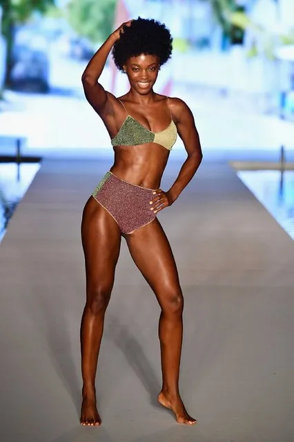 A model wearing a color-block bikini walks the runway for the swimsuit show during the Paraiso Fashion Fair in Miami at the W South Beach hotel on July 15, 2018. (Photo by Alexander Tamargo/Getty Images for Sports Illustrated)