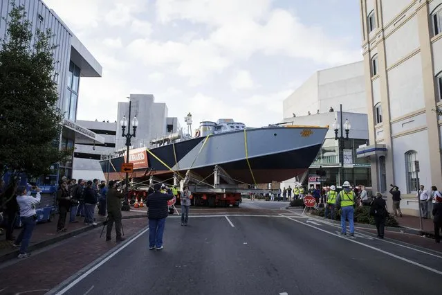 The U.S.S. Sudden Jerk, a PT-305 WWII vessel, is removed from the National WWII Museum's John E. Kushner Restoration Pavilion in New Orleans, on Saturday, November 19, 2016. The National World War II Museum says the 78-foot-long PT-305 is the only combat veteran PT boat that's restored and in working order. The museum plans to use the boat for tours on Lake Pontchartrain, the huge tidal basin along New Orleans' northern city line. Its boathouse will include displays about its history. (Photo by Sophia Germer/The Advocate via AP Photo)
