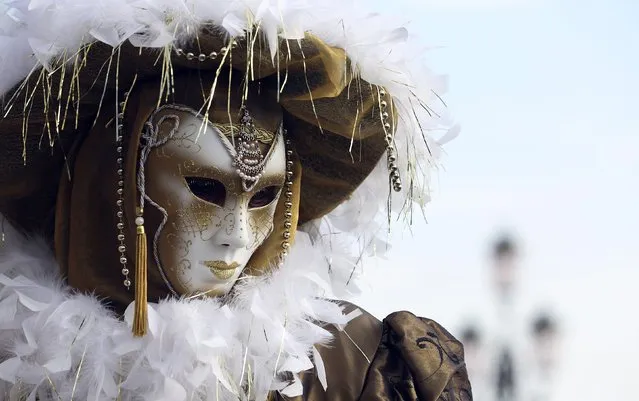 A masked reveller poses in St. Mark's square during the Carnival in Venice, February 7, 2015. (Photo by Stefano Rellandini/Reuters)
