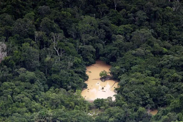 An aerial view shows an illegal mining camp during an operation to combat illegal mining and logging conducted by agents of the Brazilian Institute for the Environment and Renewable Natural Resources, or Ibama, supported by military police, in the municipality of Novo Progresso, Para State, northern Brazil, November 11, 2016. (Photo by Ueslei Marcelino/Reuters)