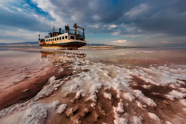 End Floating by Saeed Mohammadzadeh, Iran, winner of the environmental photographer of the year prize 2018. This stunning image shows a ship sitting in salt in the Urmia Lake in Iran. Climate change is intensifying the droughts that speed up evaporation in the country. The lake is also suffering from illegal wells and a proliferation of dams and irrigation projects, causing it to shrink. Noxious, salt-tinged dust storms inflame the eyes, skin, and lungs of residents in surrounding areas. The drying up of the river is also destroying local habitats. With extreme salinity levels of 340g per litre, the lake is more than eight times saltier than ocean water. (Photo by Saeed Mohammadzadeh/2018 Ciwem environmental photographer of the year 2018)