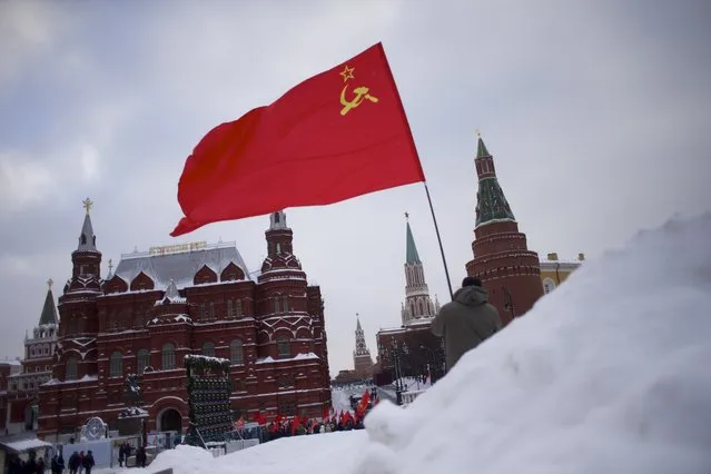 Pro Communists with Soviet flags gather outside the Kremlin to go to the mausoleum of Soviet founder Vladimir Lenin to mark his 92nd  anniversary of his death at Red Square in Moscow, Thursday, January 21, 2016. (Photo by Ivan Sekretarev/AP Photo)
