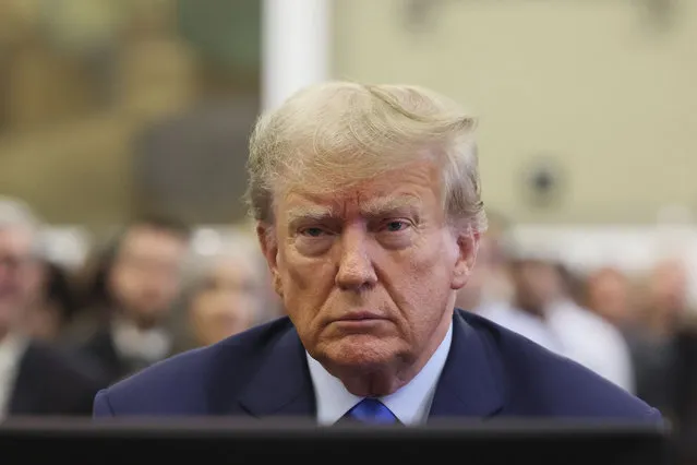 Former President Donald Trump sits in the courtroom at New York Supreme Court, Monday, October 2, 2023, in New York. Trump is making a rare, voluntary trip to court in New York for the start of a civil trial in a lawsuit that already has resulted in a judge ruling that he committed fraud in his business dealings. (Photo by Brendan McDermid/Pool Photo via AP Photo)