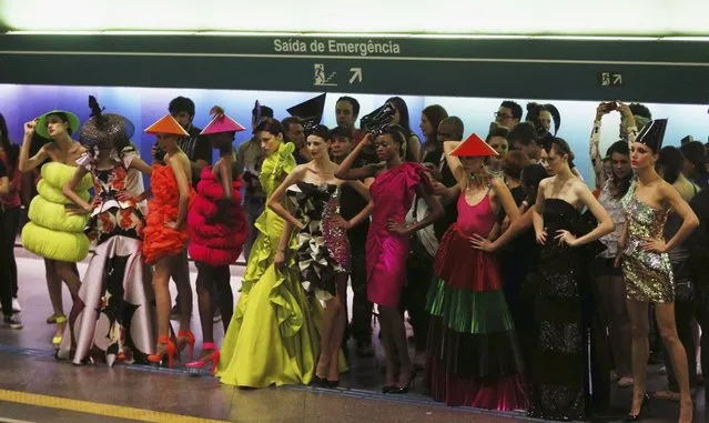 Models present creations in a subway station during Sao Paulo Fashion Week in Sao Paulo October 27, 2013. (Photo by Paulo Whitaker/Reuters)