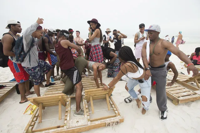 People gather to twerk during spring break festivities in Panama City Beach, Florida March 12, 2015. (Photo by Michael Spooneybarger/Reuters)