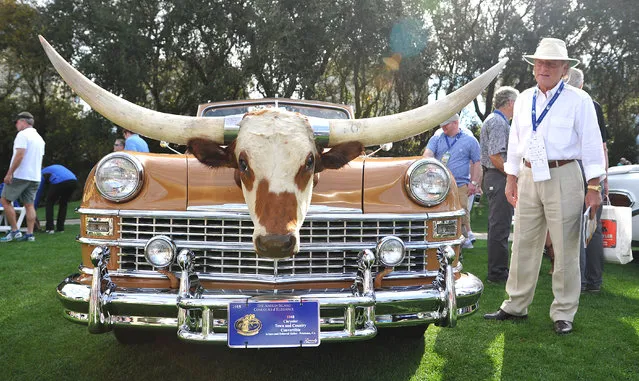 A Leo Carillo 1948 Chrysler Town and Country Convertible, with a steer head on it's hood, gathered a fair share of attention Sunday, March 15, 2015 in Amelia Island, Fla. The 20th Amelia Island Concours d'Elegance, was held at the on the golf club of the Ritz-Carlton. Sir Sterling Moss, 85, legendary British race car driver, was this year's honoree. (Photo by Bruce Lipsky/AP Photo/Florida Times-Union)