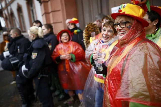 Police patrol as revellers take part in the traditional “Weiberfastnacht” (Women's Carnival) celebration in Mainz, Germany, February 4, 2016. (Photo by Kai Pfaffenbach/Reuters)