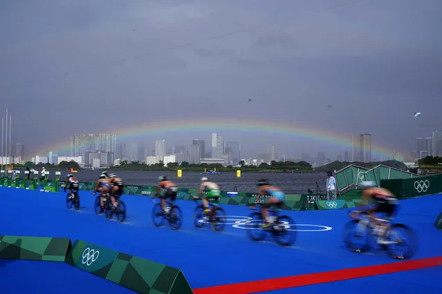 A rainbow is seen as athletes compete in the bike leg of the women's individual triathlon competition at the 2020 Summer Olympics, Tuesday, July 27, 2021, in Tokyo, Japan. (Photo by David Goldman/AP Photo)