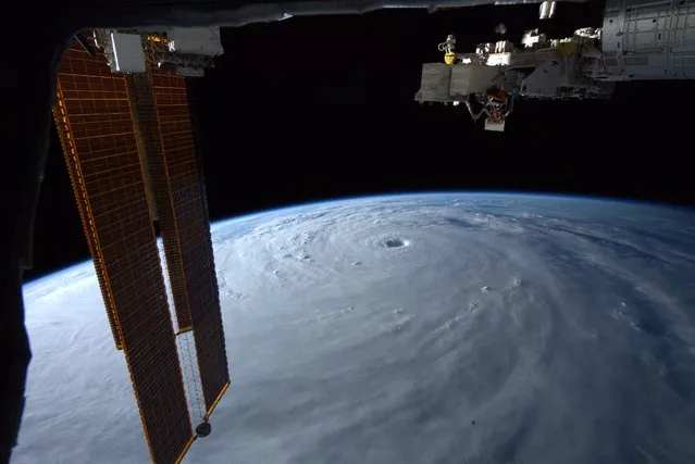This handout photo provided by US astronaut Bob Hines on September 18, 2022, shows an overhead view of Typhoon Nanmadol from space. One person was confirmed dead in Japan on September 19, 2022, after Typhoon Nanmadol slammed into the country, injuring dozens, but authorities downgraded warnings as the storm weakened after landfall. (Photo by Bob Hines/NASA via AFP Photo)