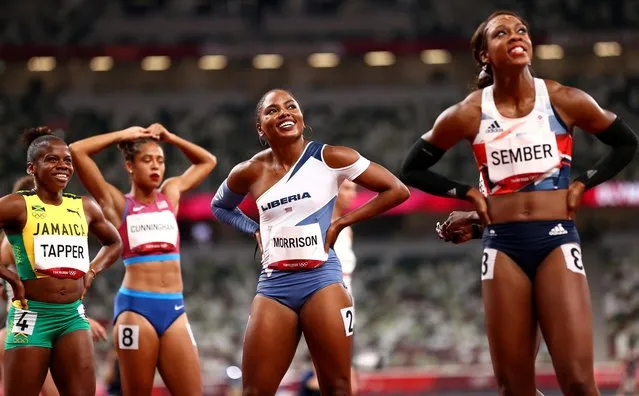 Megan Tapper of Jamaica, Ebony Morrison of Liberia, and Cindy Sember of Britain after competing in the Women's 100m Hurdles Semi-Final on day nine of the Tokyo 2020 Olympic Games at Olympic Stadium on August 01, 2021 in Tokyo, Japan. (Photo by Andrew Boyers/Reuters)