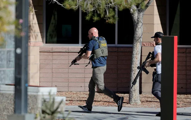 Law enforcement officers head into UNLV campus after reports of an active shooter in Las Vegas, Nevada, U.S. December 6, 2023. (Photo by Steve Marcus/Las Vegas Sun via Reuters)