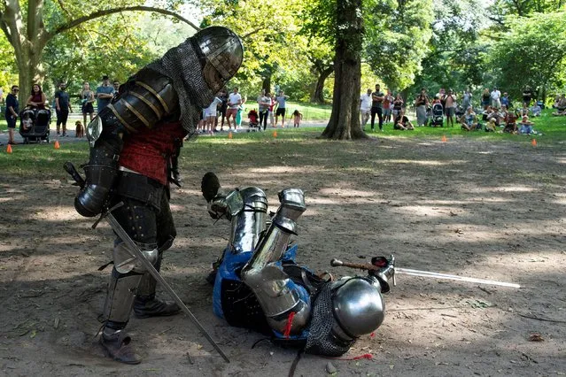 People in full medieval armor take part in a combat at Central Park in New York, U.S., August 14, 2021. (Photo by Eduardo Munoz/Reuters)