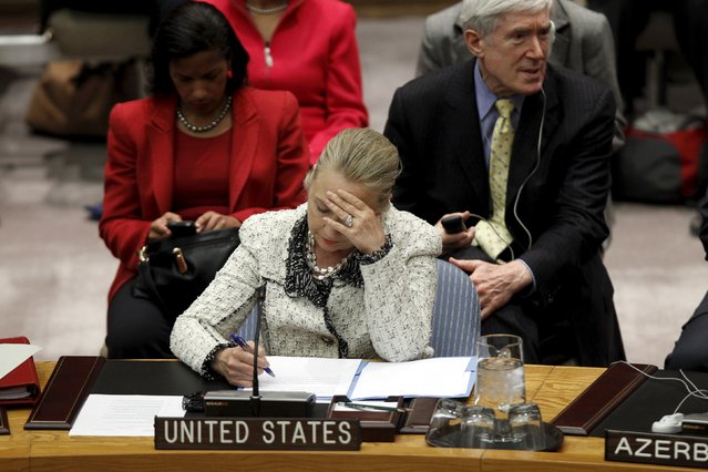 U.S. Secretary of State Hillary Clinton reads her notes during a Security Council meeting to discuss Peace and Security in the Middle East during the 67th United Nations General Assembly at the U.N. Headquarters in New York, in this September 26, 2012 file photo. (Photo by Keith Bedford/Reuters)