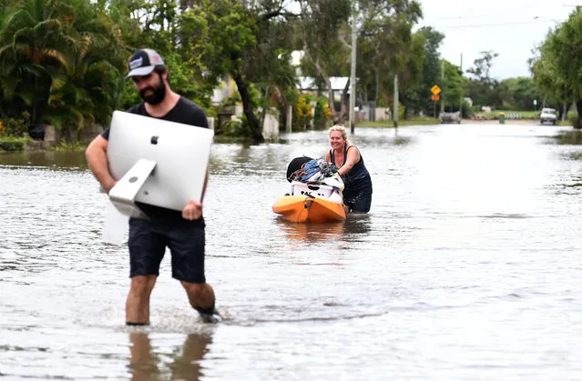 Local residents salvage items from their flood-affected home in the suburb of Hermit Park in Townsville, Queensland, Australia, 06 February 2019. Residents have begun cleaning up after days of torrential rain and unprecedented water releases from the city's swollen dam, sending torrents of water down the Ross River and into the city, swamping roads, yards and homes. (Photo by Dan Peled/EPA/EFE)