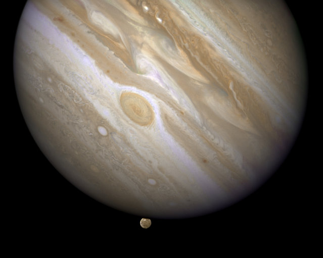 The planet Jupiter is shown with one of its moons, Ganymede (bottom), in this NASA handout taken April 9, 2007. Scientists using the Hubble Space Telescope have confirmed that the Jupiter-orbiting moon Ganymede has an ocean beneath its icy surface, raising the prospects for life, NASA said. (Photo by Reuters/NASA/ESA/E. Karkoschka)