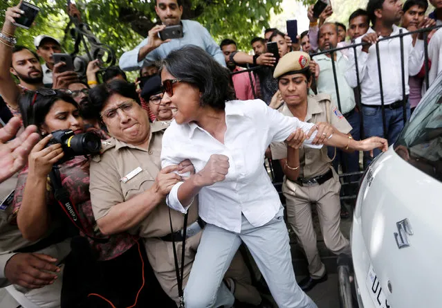Police officers detain a demonstrator during a protest after a panel of judges dismissed a sexual harassment complaint against Chief Justice of India (CJI) Ranjan Gogoi, outside Supreme Court in New Delhi, India on May 7, 2019. (Photo by Adnan Abidi/Reuters)
