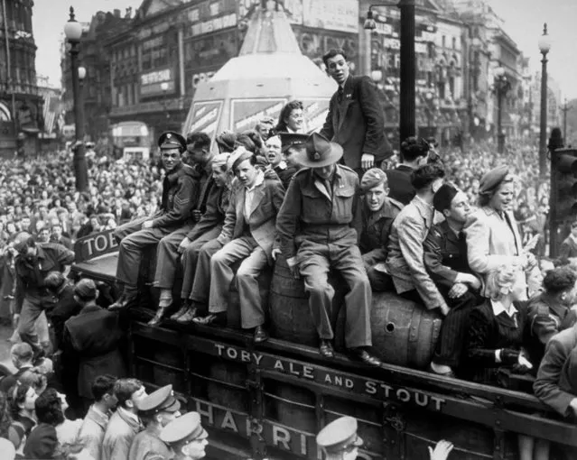 A van load of beer passing through Piccadilly Circus on VE Day, 8th May 1945. The statue of Eros, protected during the war by advertising hoardings, can be seen in the background. (Photo by Keystone/Getty Images)